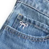 Düşük Bel Nakışlı Fiyonklu Denim Mini Etek
