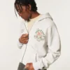 Kutu Kesim Fermuarlı Miami Üniversitesi Hurricanes Grafik Kapüşonlu Sweatshirt Kutu Kesim Fermuarlı Miami Üniversitesi Hurricanes Grafik Kapüşonlu Sweatshirt